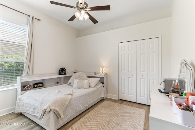 3820 Danforth Dr W, Jacksonville, FL 32224 - bedroom featuring wood finished floors, a closet, baseboards, and ceiling fan