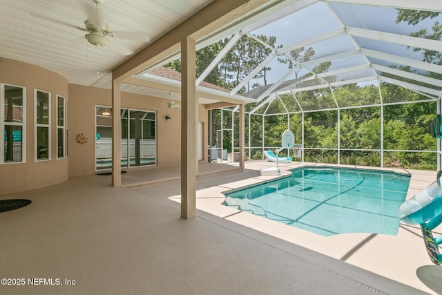 3820 Danforth Dr W, Jacksonville, FL 32224 - swimming pool with ceiling fan, a patio, and glass enclosure