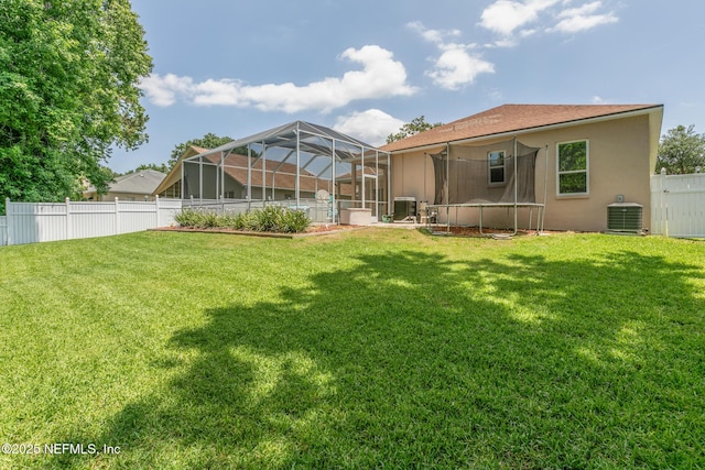 3820 Danforth Dr W, Jacksonville, FL 32224 - view of yard with a trampoline and central AC