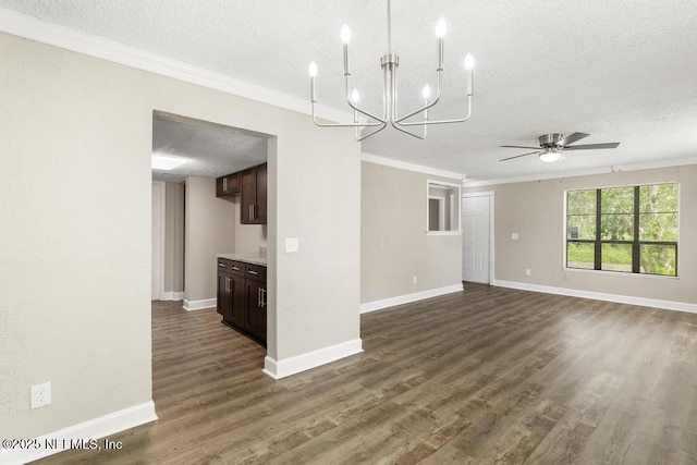 2718 Parkrus Ln, Jacksonville, FL 32208 - unfurnished living room featuring a textured ceiling, ornamental molding, a ceiling fan, dark wood-type flooring, and a chandelier