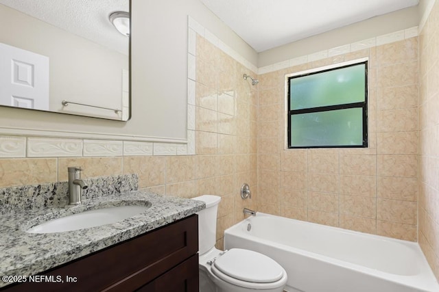 2718 Parkrus Ln, Jacksonville, FL 32208 - full bath with tile walls, shower / washtub combination, toilet, vanity, and tasteful backsplash