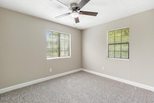 2718 Parkrus Ln, Jacksonville, FL 32208 - carpeted empty room featuring ceiling fan, baseboards, and a textured ceiling