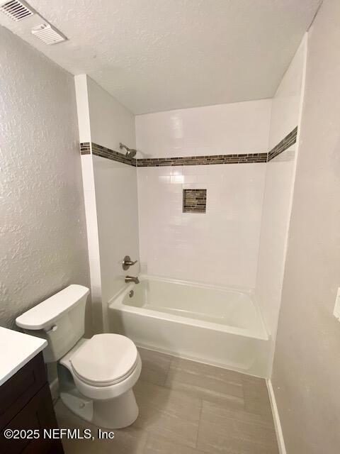 425 Timberwalk Ct Unit 1135, Ponte Vedra Beach, FL 32082 - full bathroom with vanity, toilet,  shower combination, a textured wall, and a textured ceiling