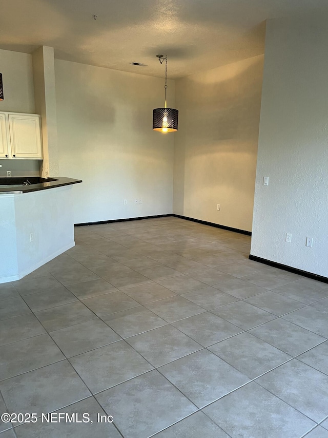 425 Timberwalk Ct Unit 1135, Ponte Vedra Beach, FL 32082 - unfurnished dining area with light tile patterned flooring and baseboards