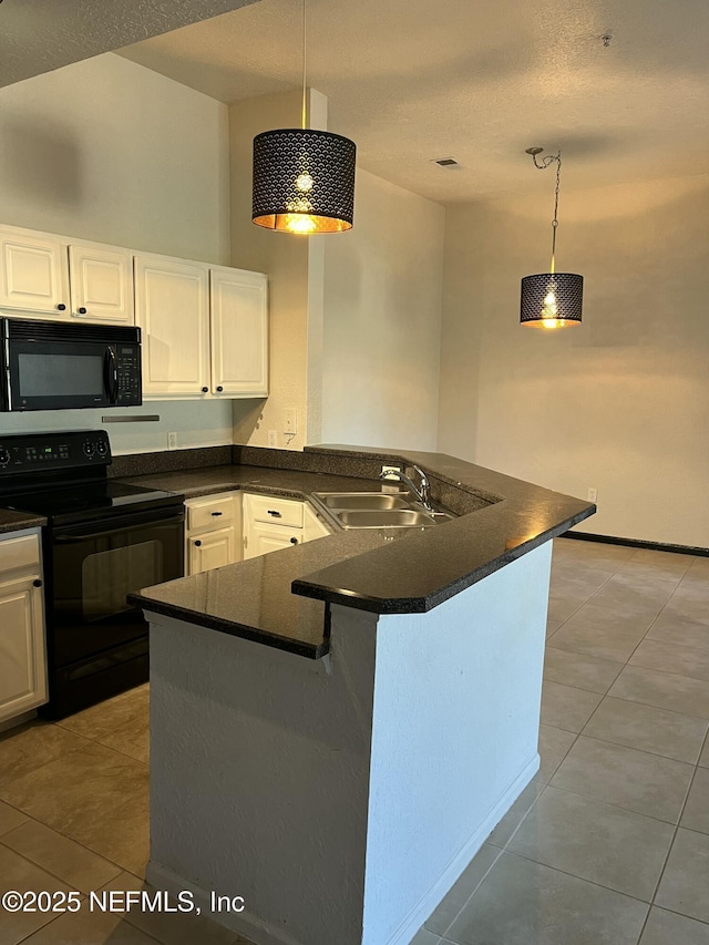 425 Timberwalk Ct Unit 1135, Ponte Vedra Beach, FL 32082 - kitchen featuring black appliances, dark countertops, a sink, light tile patterned floors, and white cabinets