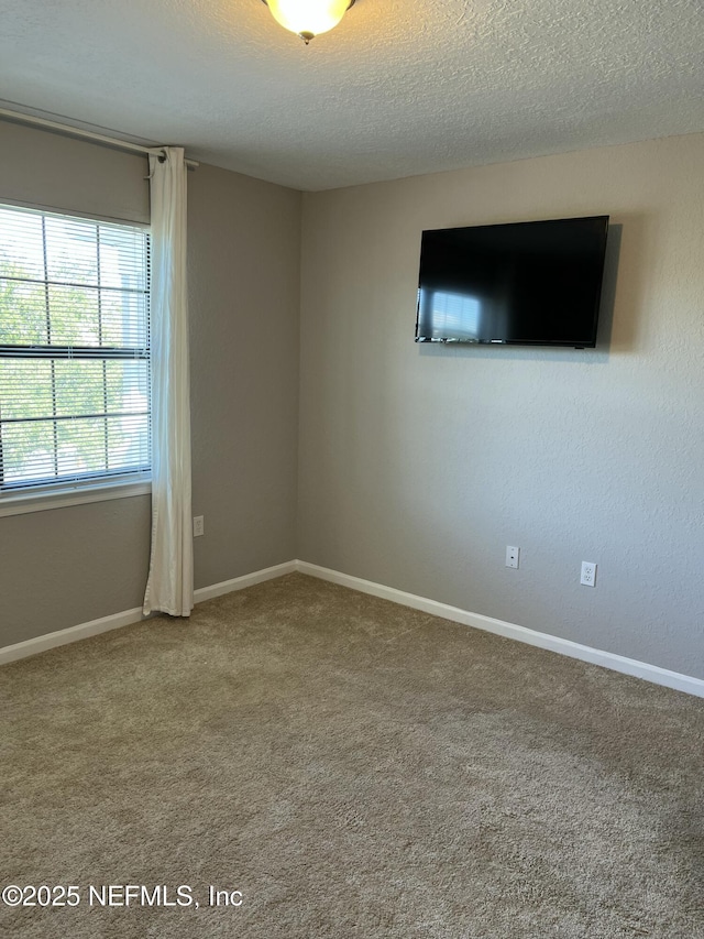 425 Timberwalk Ct Unit 1135, Ponte Vedra Beach, FL 32082 - carpeted empty room with a textured ceiling and baseboards