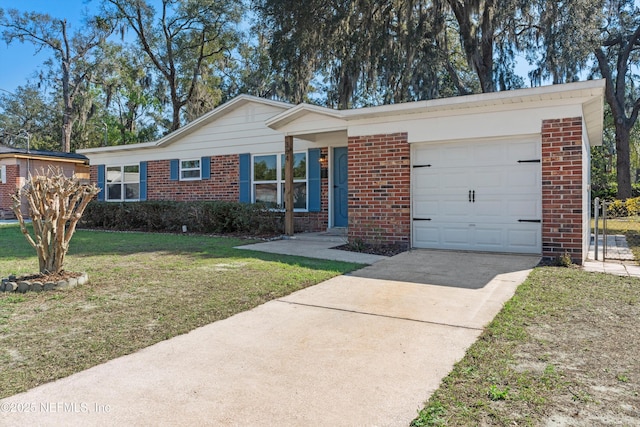 364 Aries Dr, Orange Park, FL 32073 - ranch-style house featuring brick siding, concrete driveway, a front lawn, and a garage