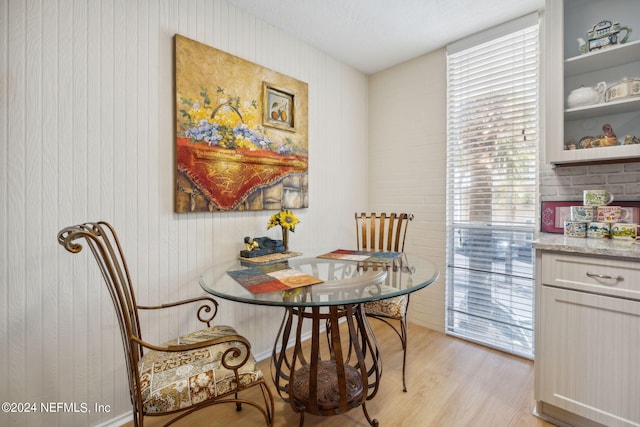 901 Ocean Blvd Unit 98, Atlantic Beach, FL 32233 - dining area featuring light wood-type flooring and wooden walls