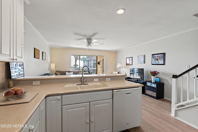 2327 Costa Verde Blvd Unit 201, Jacksonville Beach, FL 32250 - kitchen with dishwasher, a sink, open floor plan, ornamental molding, and light wood-type flooring