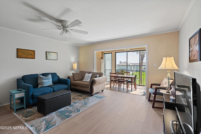 2327 Costa Verde Blvd Unit 201, Jacksonville Beach, FL 32250 - living area featuring wood finished floors, crown molding, and a ceiling fan