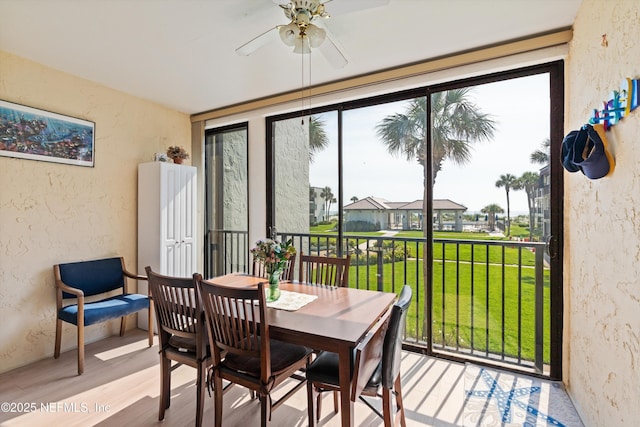 2327 Costa Verde Blvd Unit 201, Jacksonville Beach, FL 32250 - dining space with a textured wall, a ceiling fan, and wood finished floors