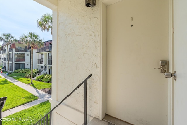 2327 Costa Verde Blvd Unit 201, Jacksonville Beach, FL 32250 - view of exterior entry with stucco siding