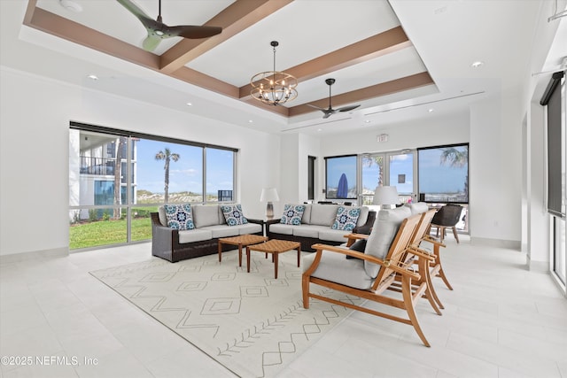 2327 Costa Verde Blvd Unit 201, Jacksonville Beach, FL 32250 - living room featuring a chandelier, ceiling fan, healthy amount of natural light, a tray ceiling, and recessed lighting