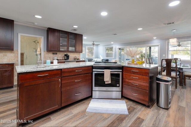 5253 Royce Ave, Jacksonville, FL 32205 - kitchen with electric stove, ornamental molding, ceiling fan, recessed lighting, and light wood-type flooring