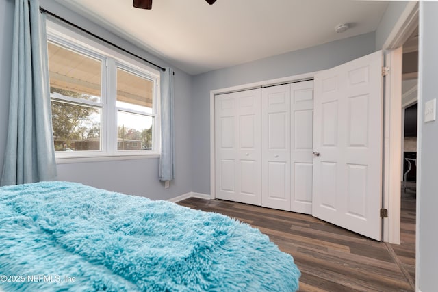 5253 Royce Ave, Jacksonville, FL 32205 - bedroom featuring dark wood-type flooring, ceiling fan, a closet, and baseboards