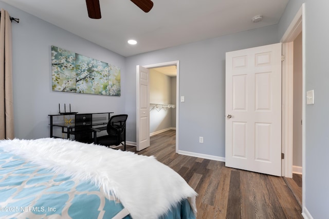 5253 Royce Ave, Jacksonville, FL 32205 - bedroom featuring dark wood-style flooring, baseboards, recessed lighting, a ceiling fan, and a walk in closet