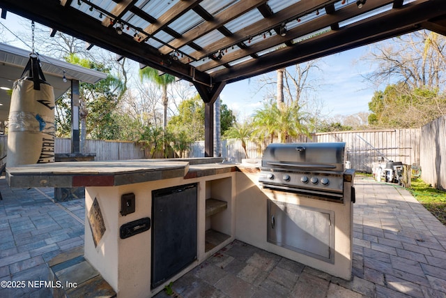 5253 Royce Ave, Jacksonville, FL 32205 - fenced backyard with a pergola and a patio area