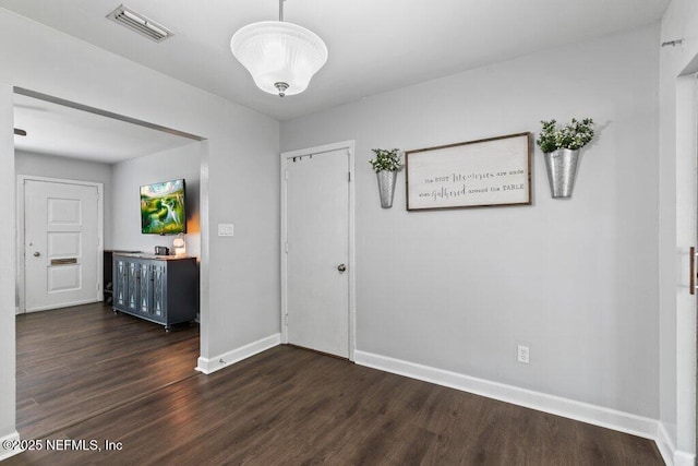 1702 Dibble Cir E, Jacksonville, FL 32246 - hall with dark wood-style floors and baseboards