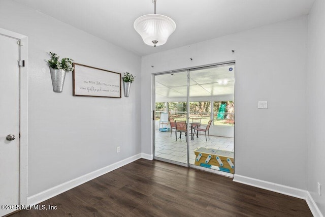 1702 Dibble Cir E, Jacksonville, FL 32246 - unfurnished dining area with dark wood finished floors and baseboards