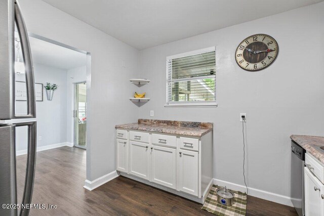 1702 Dibble Cir E, Jacksonville, FL 32246 - kitchen featuring dark wood-style floors, white cabinets, baseboards, and stainless steel dishwasher