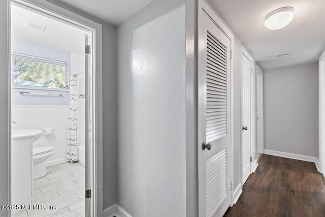 1702 Dibble Cir E, Jacksonville, FL 32246 - hallway featuring wood finished floors and baseboards