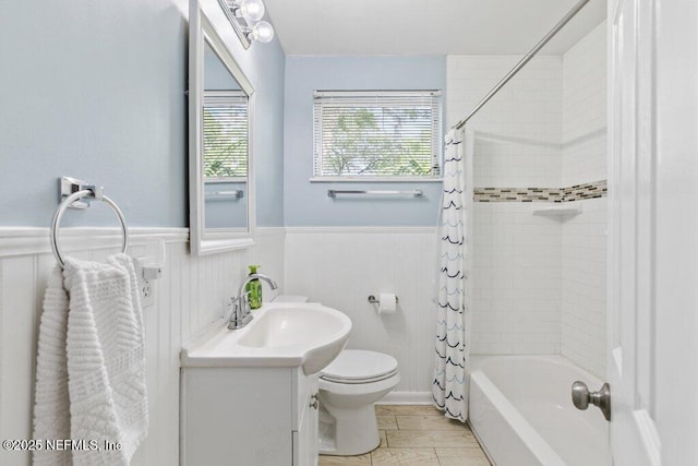 1702 Dibble Cir E, Jacksonville, FL 32246 - bathroom featuring wainscoting, vanity, toilet, and shower / tub combo