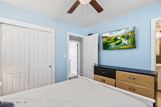 1702 Dibble Cir E, Jacksonville, FL 32246 - bedroom with a closet and a ceiling fan