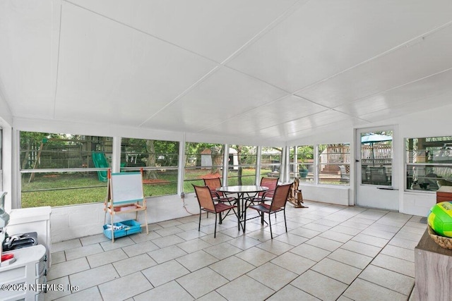 1702 Dibble Cir E, Jacksonville, FL 32246 - sunroom with tile patterned floors and outdoor dining space