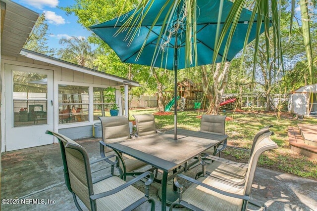 1702 Dibble Cir E, Jacksonville, FL 32246 - view of patio with a playground and outdoor dining area