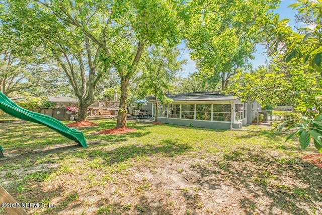 1702 Dibble Cir E, Jacksonville, FL 32246 - view of yard with a playground and a sunroom