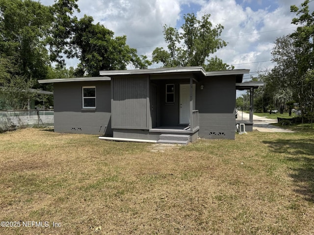 3114 Breve Dr, Jacksonville, FL 32209 - view of front facade with a front yard and central AC