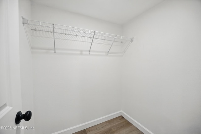 6114 Suwanee Rd, Jacksonville, FL 32217 - walk in closet featuring wood finished floors