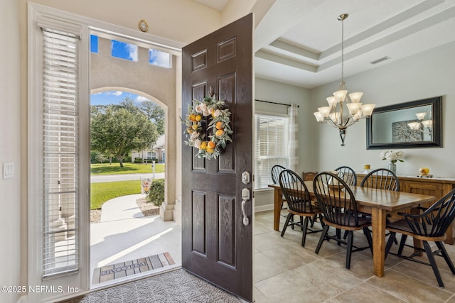 32479 Willow Parke Cir, Fernandina Beach, FL 32034 - entryway featuring a chandelier and light tile patterned flooring