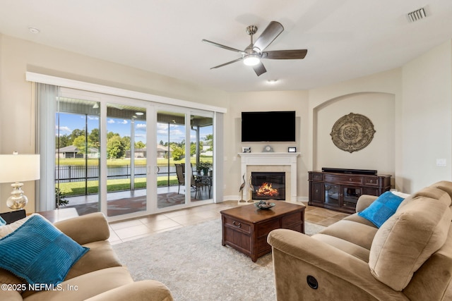 32479 Willow Parke Cir, Fernandina Beach, FL 32034 - living area with a ceiling fan, light tile patterned floors, and a glass covered fireplace