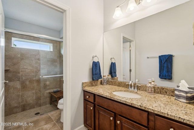 32479 Willow Parke Cir, Fernandina Beach, FL 32034 - bathroom with vanity, a stall shower, toilet, and tile patterned flooring