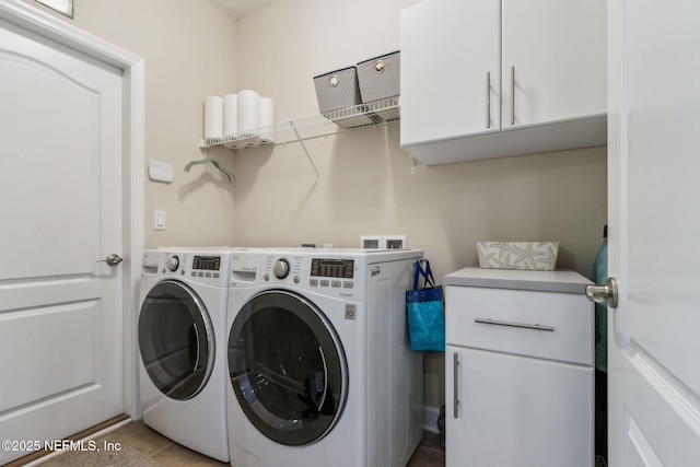 32479 Willow Parke Cir, Fernandina Beach, FL 32034 - laundry area with washer and dryer, cabinet space, and tile patterned floors