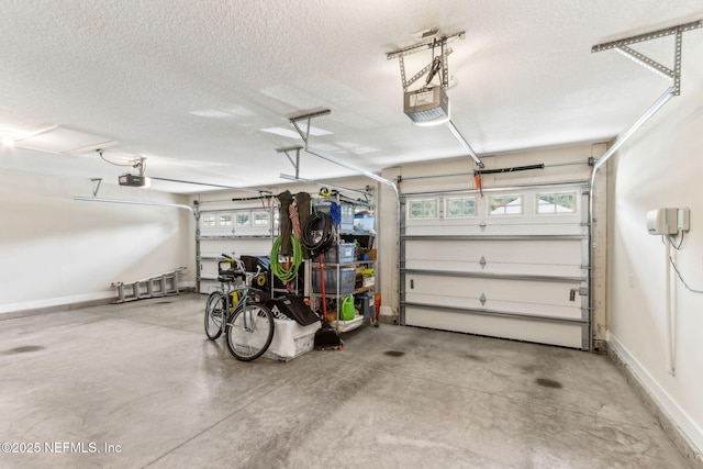 32479 Willow Parke Cir, Fernandina Beach, FL 32034 - garage featuring a garage door opener and baseboards