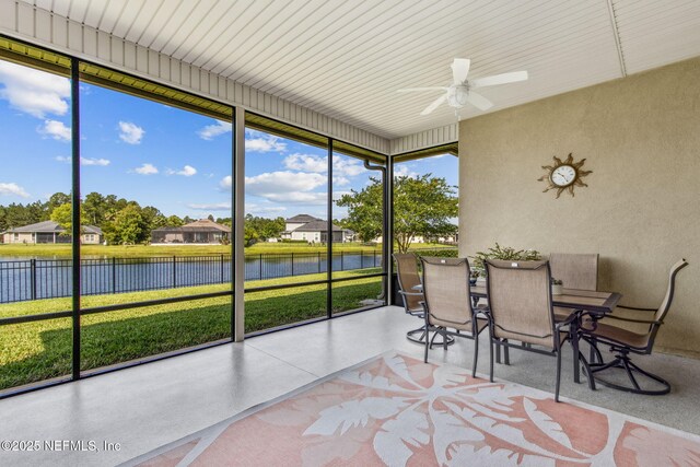 32479 Willow Parke Cir, Fernandina Beach, FL 32034 - sunroom featuring a water view, ceiling fan, outdoor dining space, and a residential view