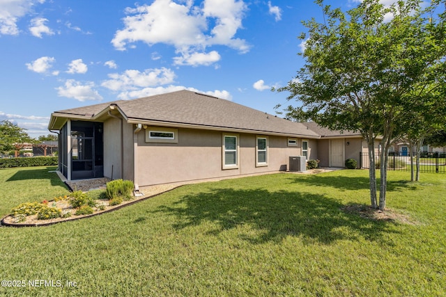 32479 Willow Parke Cir, Fernandina Beach, FL 32034 - rear view of property with central AC unit, stucco siding, and a sunroom