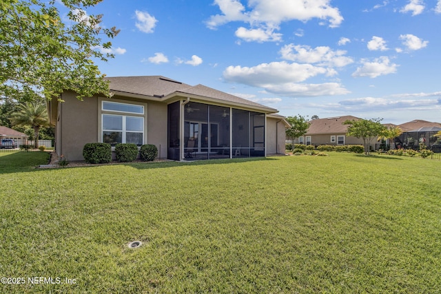 32479 Willow Parke Cir, Fernandina Beach, FL 32034 - rear view of property with a sunroom and stucco siding