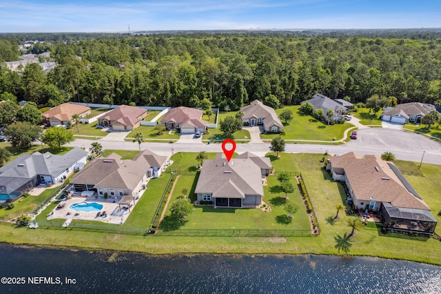 32479 Willow Parke Cir, Fernandina Beach, FL 32034 - aerial view of property and surrounding area featuring a forest, nearby suburban area, and a pool