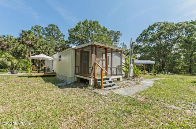 2022 Guava Ln, Bunnell, FL 32110 - view of outdoor structure with a sunroom