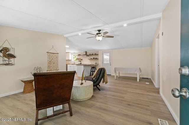2022 Guava Ln, Bunnell, FL 32110 - living area with a ceiling fan, light wood-style floors, and baseboards