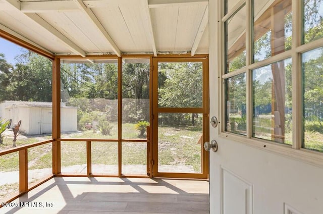2022 Guava Ln, Bunnell, FL 32110 - unfurnished sunroom with wood finished floors
