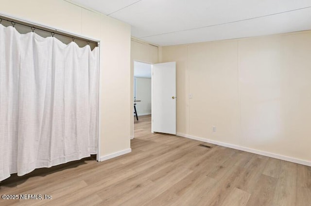 2022 Guava Ln, Bunnell, FL 32110 - spare room with light wood-style flooring and baseboards