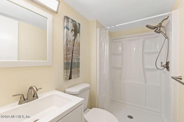 2022 Guava Ln, Bunnell, FL 32110 - bathroom with vanity, a shower with shower curtain, and toilet