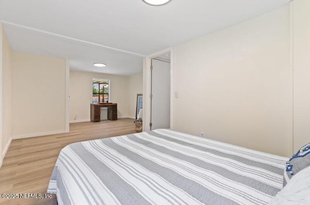 2022 Guava Ln, Bunnell, FL 32110 - bedroom featuring light wood-style floors and baseboards