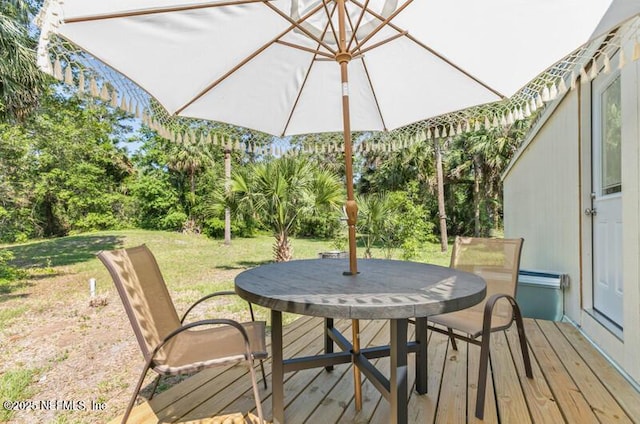 2022 Guava Ln, Bunnell, FL 32110 - wooden deck featuring a lawn and view of scattered trees