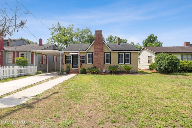 5372 Colonial Ave, Jacksonville, FL 32210 - ranch-style home featuring driveway, an attached carport, and a chimney