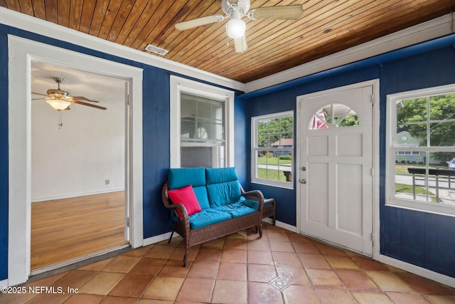 5372 Colonial Ave, Jacksonville, FL 32210 - foyer entrance featuring a ceiling fan, healthy amount of natural light, wooden ceiling, and baseboards